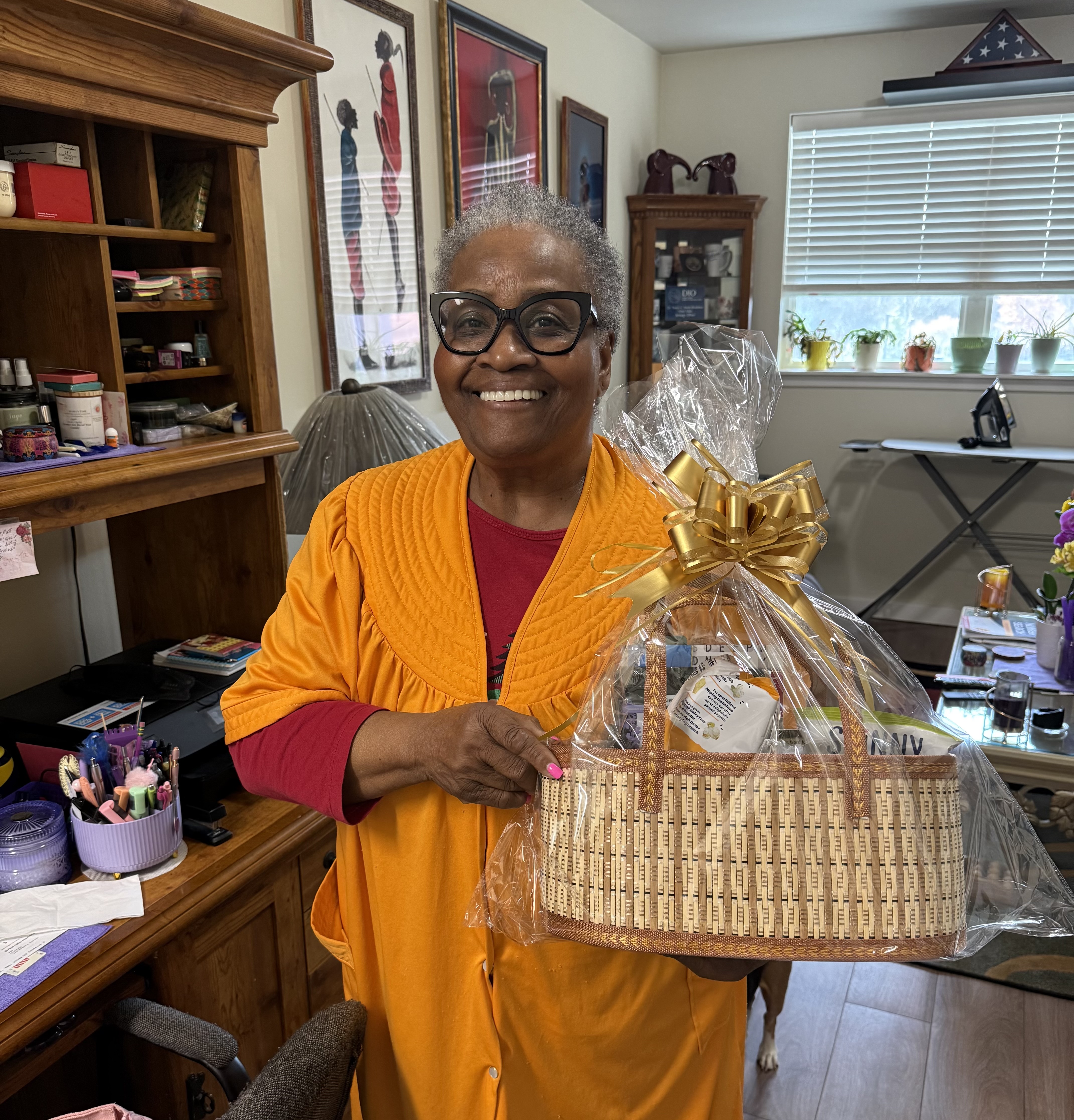 A DG25 Seasoned Saints member receiving her Easter basket